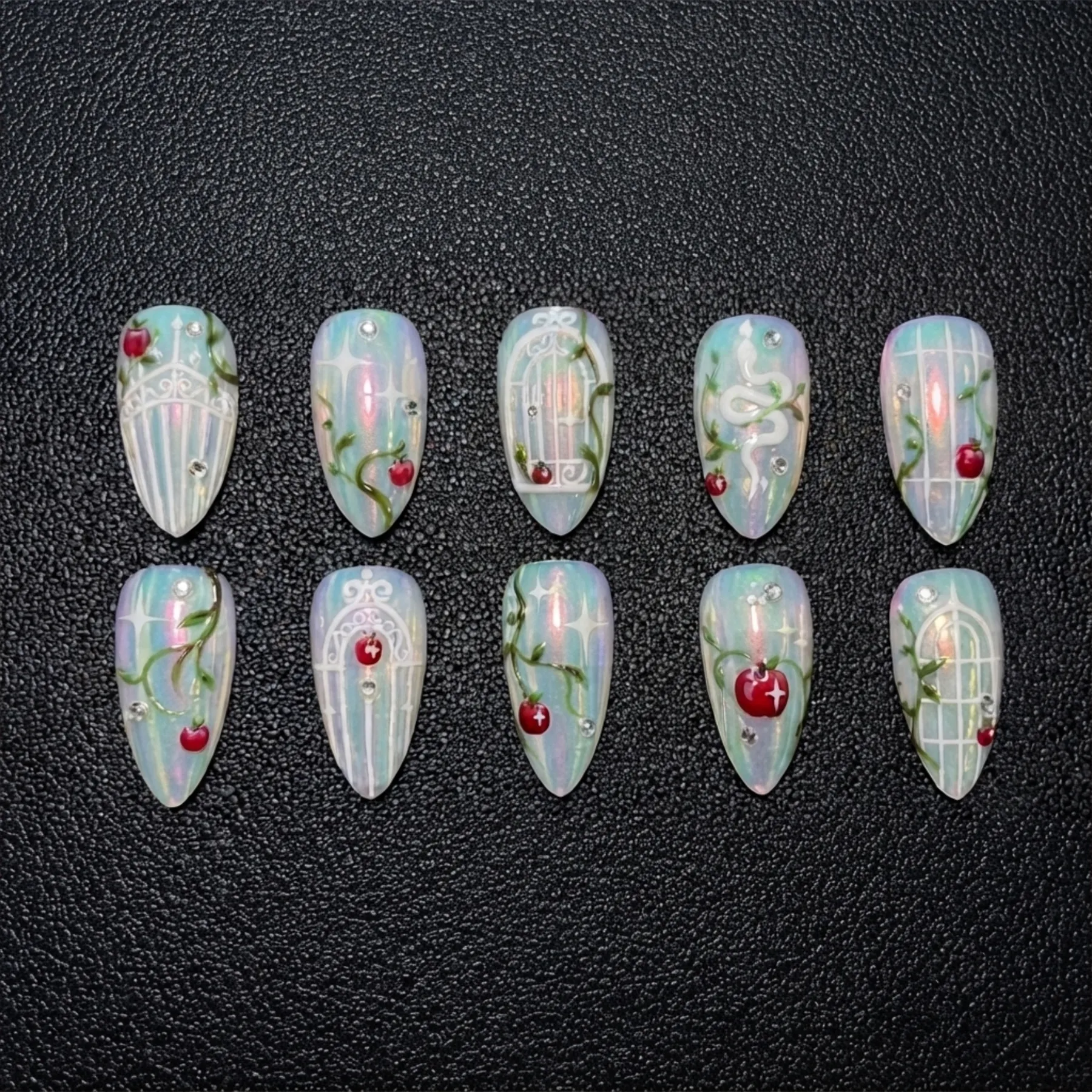 Pearl Garden nail set showing gate lines, climbing vines and red fruit