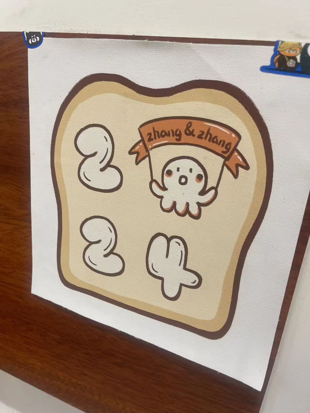 A toast illustration with a small character holding a ribbon